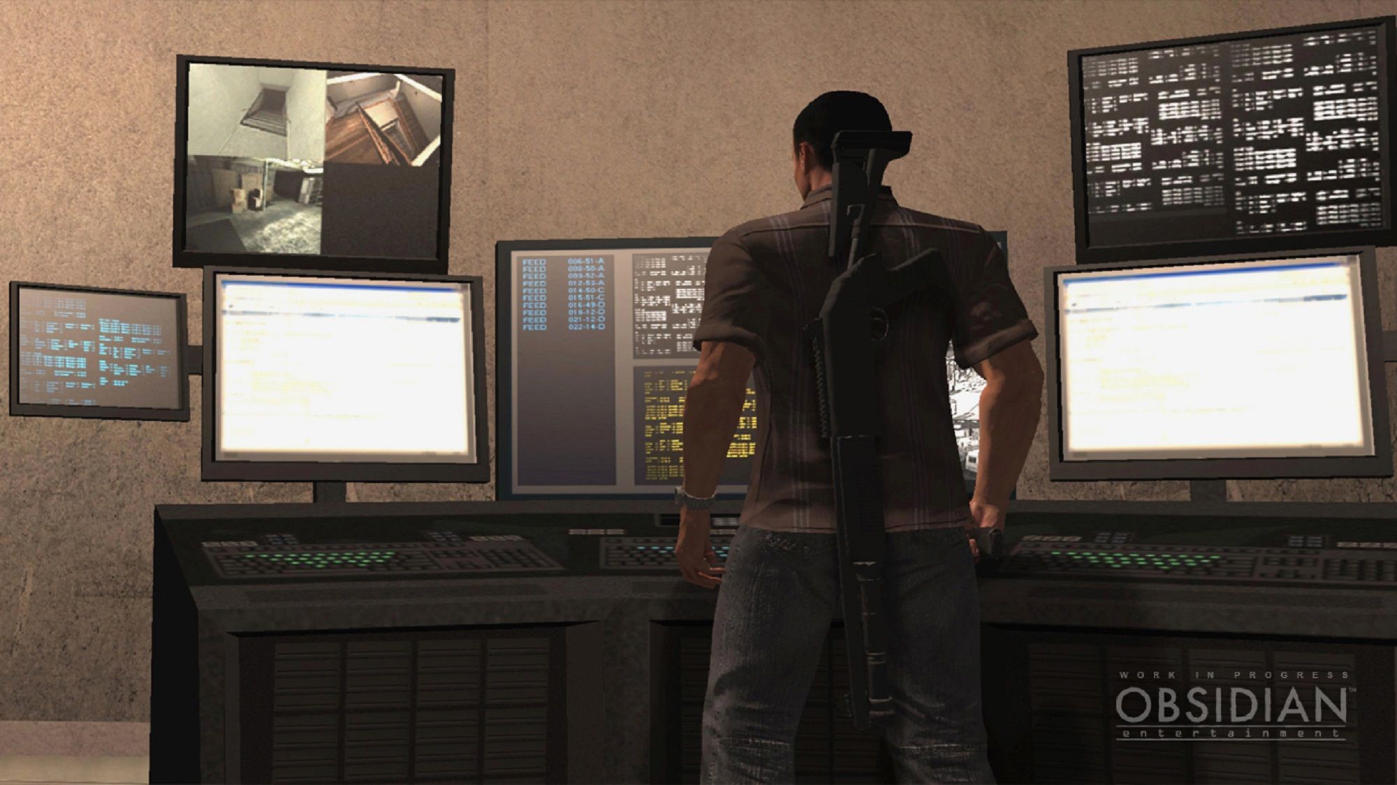 Alpha Protocol's Michael Thorton looking at a variety of computer screens