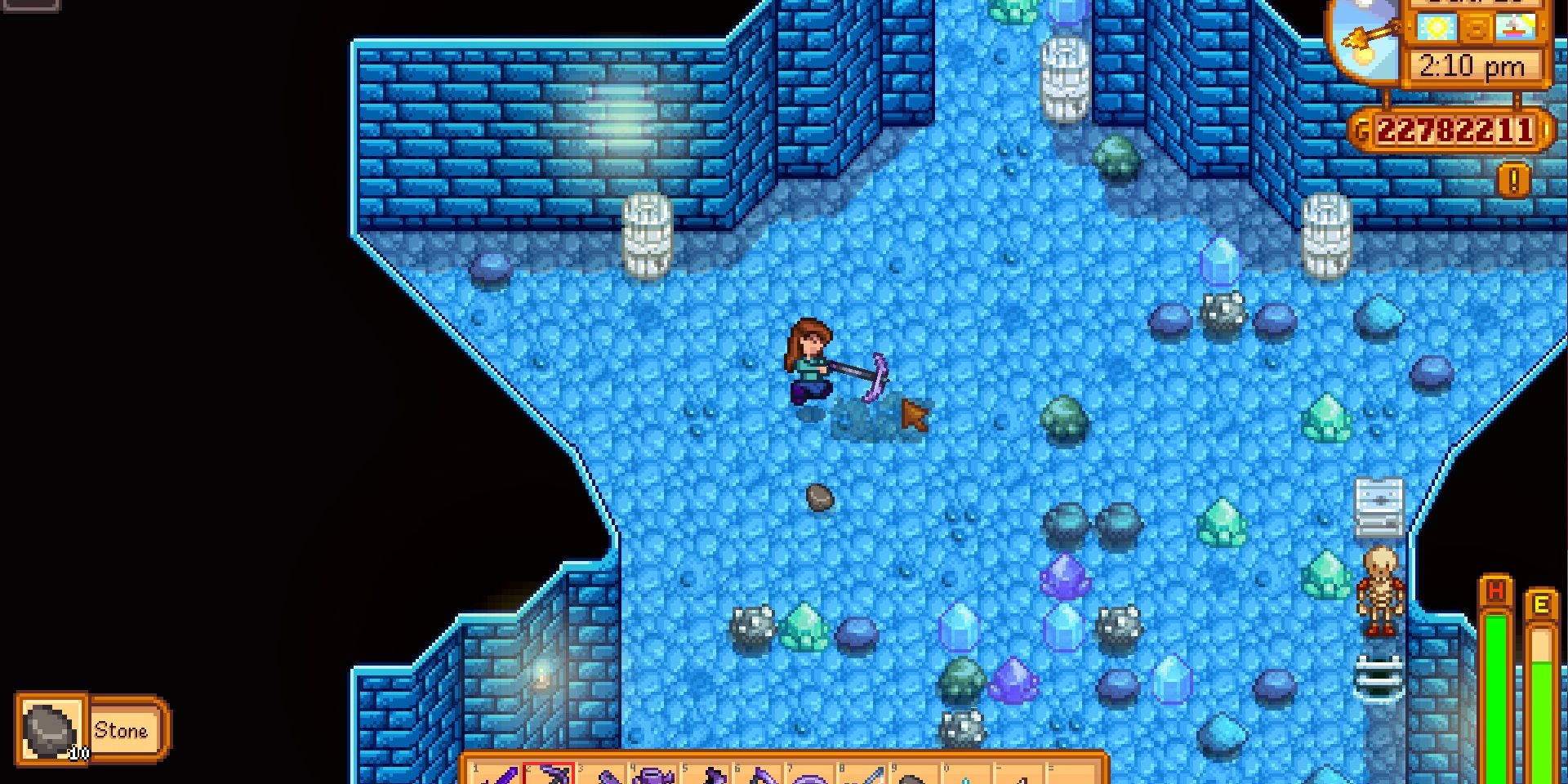 Image of the Iridium Pickaxe being used on a big rock in Stardew Valley.